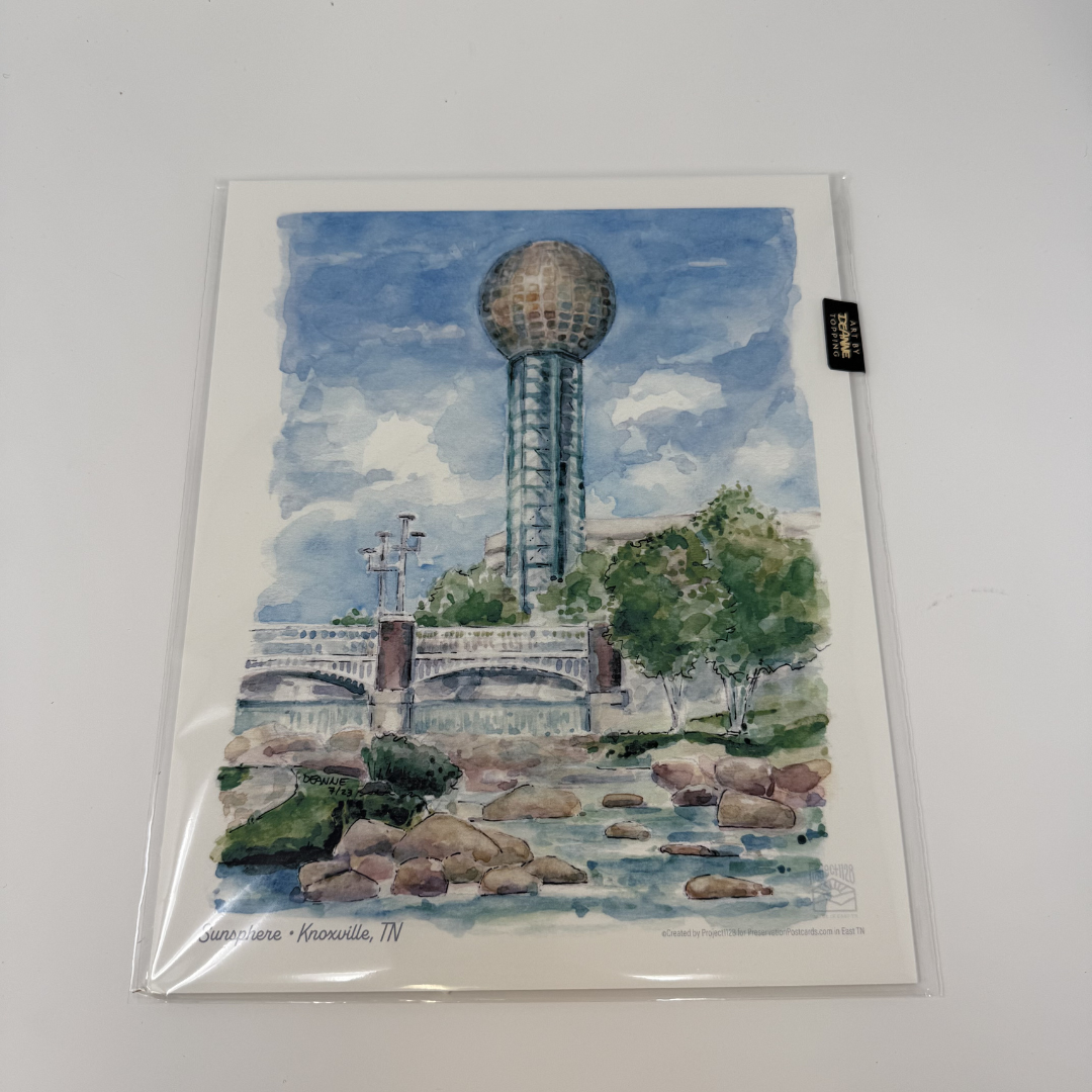 Artistic depiction of a tower and bridge with trees on a watercolor-style card.